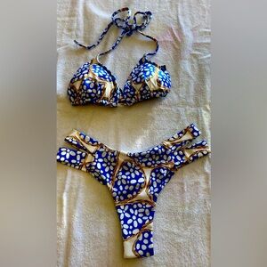 Bikini. Brazilian cut, size med. never used with tags, beautiful color/print